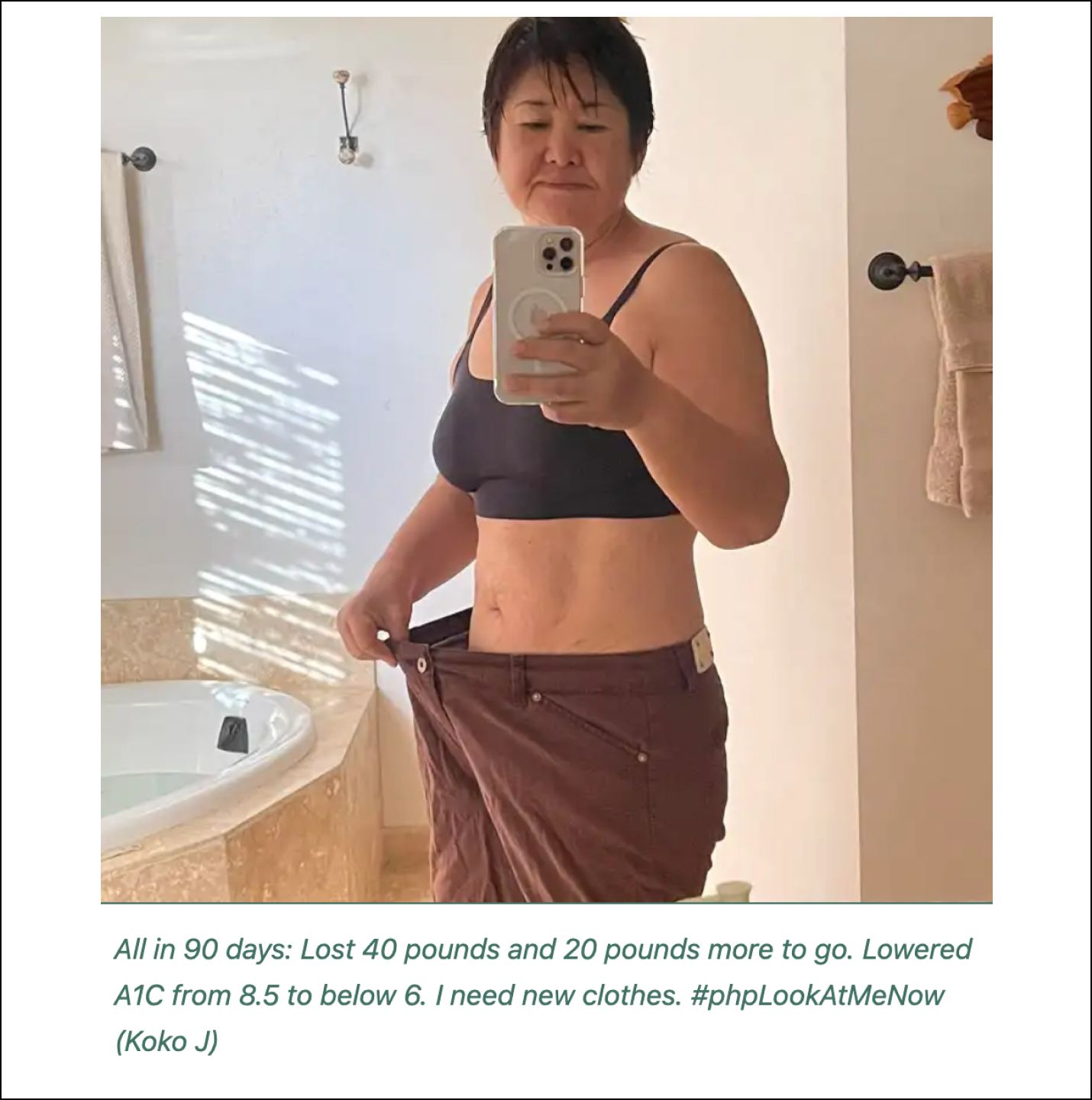 Woman shows weight loss progress in a mirror selfie.
